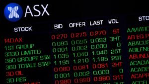 Aussie shares advance as mining stocks hit record highs