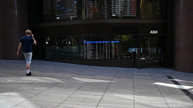 Aussie shares sink back into red as bond yields spike